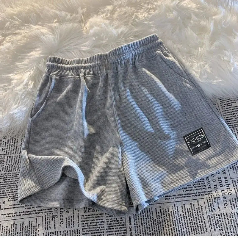Shorts esportivos femininos confortáveis com textura waffle, ideais para lazer, ciclismo, camping, caminhadas e montanhismo.