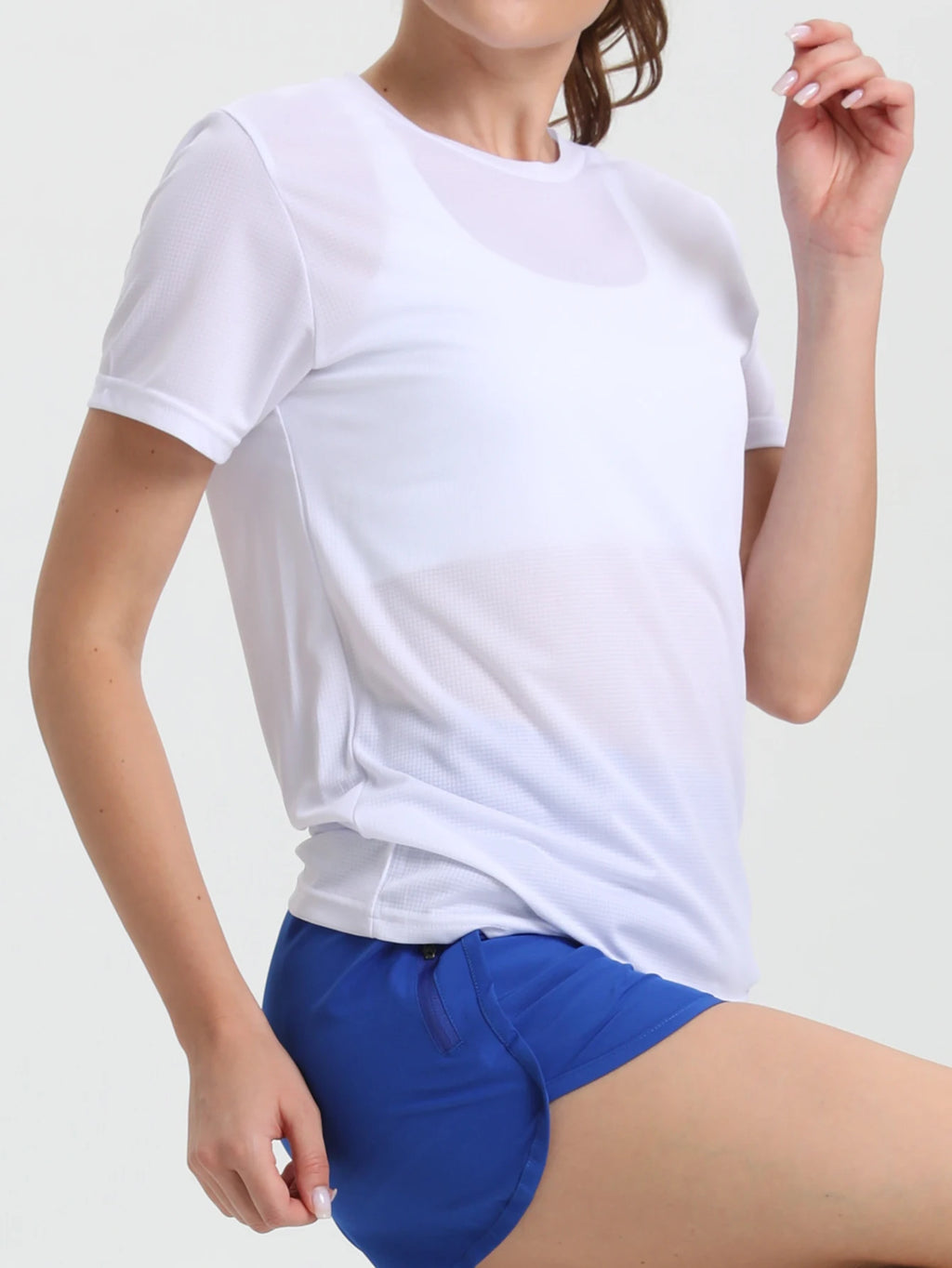 Camiseta esportiva feminina de cor sólida, ultraleve, de secagem rápida, respirável e leve, ideal para corrida e academia.